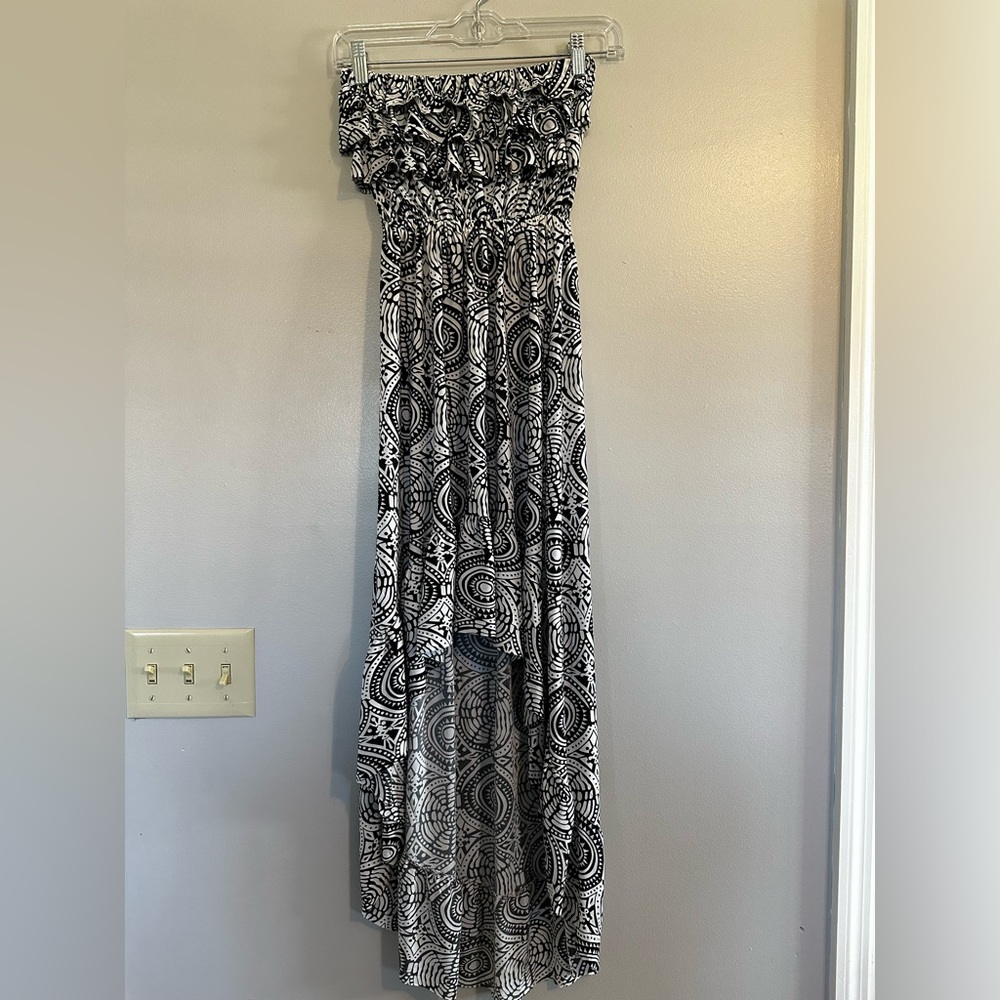 Summer sun dress with longer back skirt and ruffled bust.